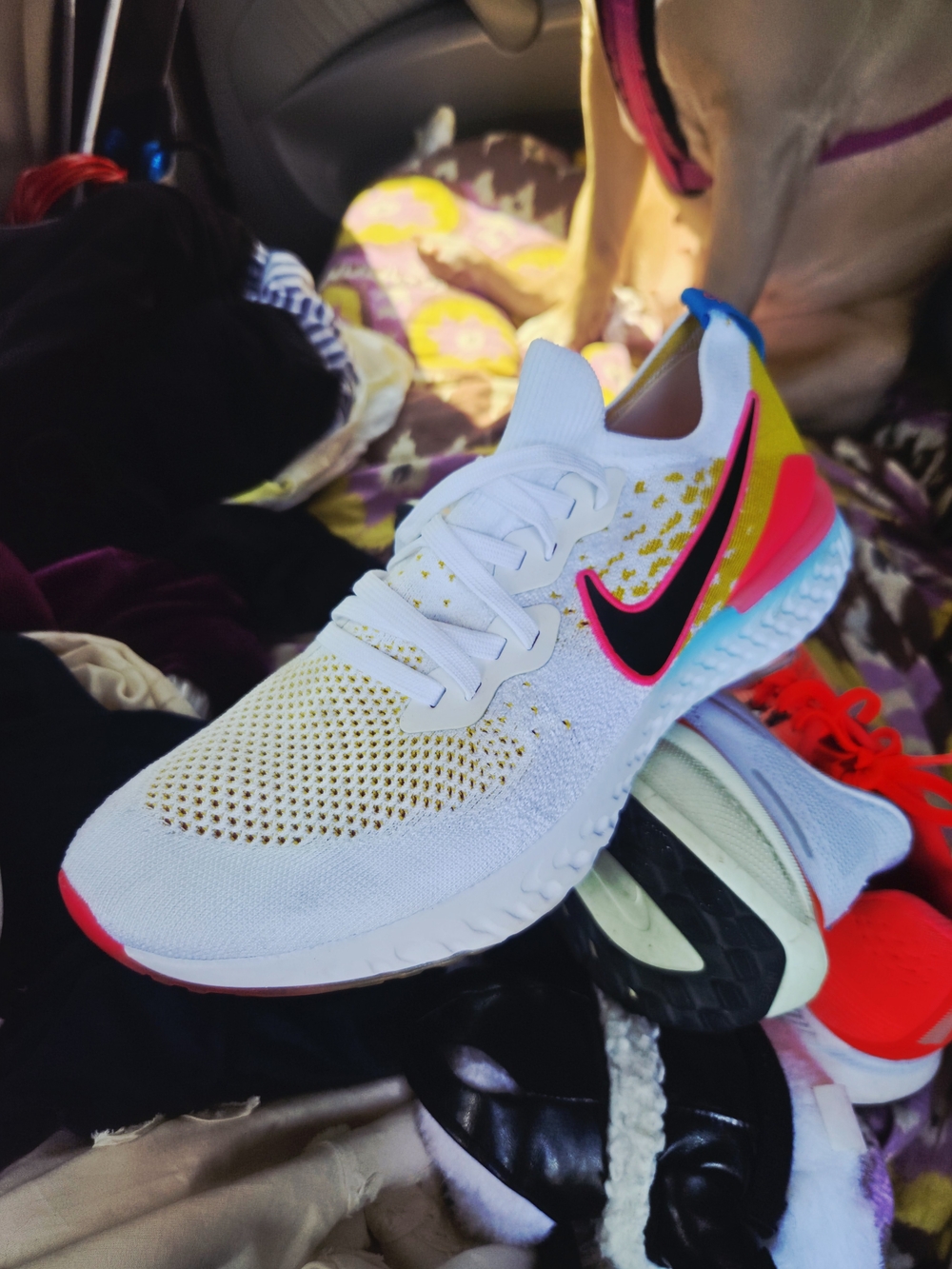 Nike White Athletic Shoe with Pink, Yellow & Blue Accents